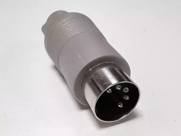 A photo of a passive 6-pin Mini-DIN to 5-pin 180° DIN adapter from its male AT end