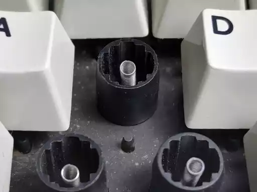 A photo showing an exposed IBM capacitive buckling spring keyswitch